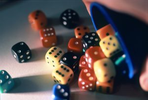 a cup full of dice, concept: board games at christmas